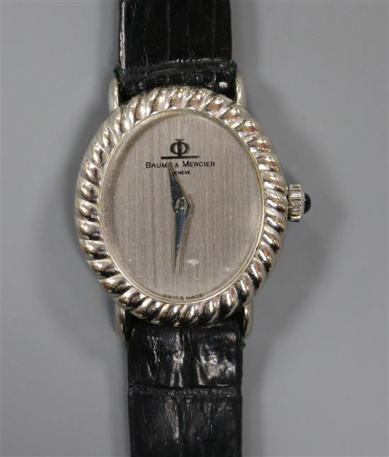 A ladys 18ct white gold Baume & Mercier manual wind oval dial wrist watch, in Baume & Mercier box.